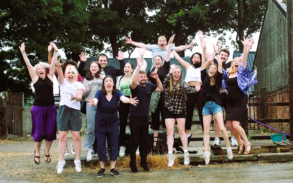 Revolution Performing Arts team including founder Fi Da Silva Adams (far left, purple skirt) and new leaders Louise Montague (second in from right in denim shorts) & Charlotte Simonis (camera right of Fi Da Silva Adams in white top, grey shorts, front row, big smile). 