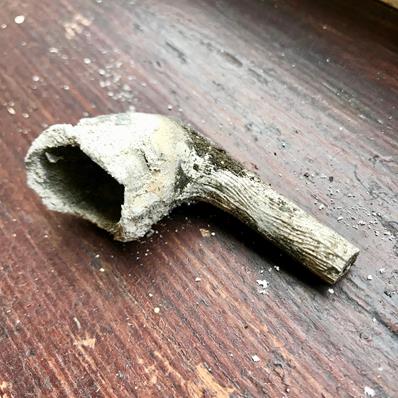 I FOUND A CLAY PIPE UNDER THE WINDOW